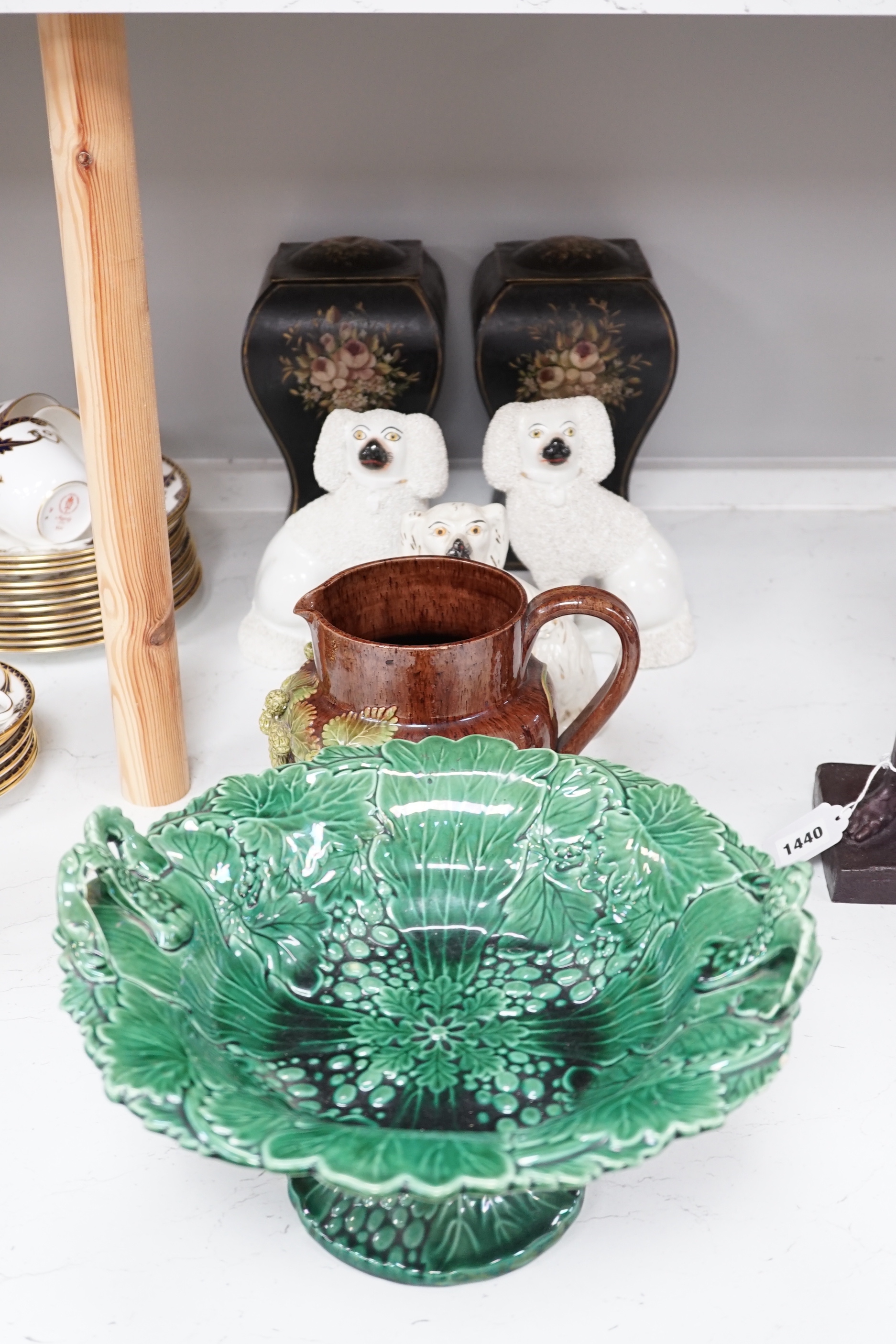 Seven items including a pair of toleware vases and covers, a Rye pottery jug, three Staffordshire dogs and a green leaf pedestal dish, Rye jug 16cm high